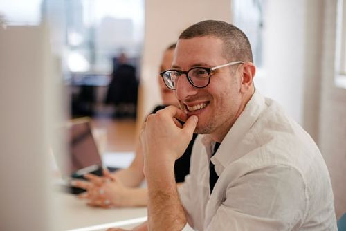 canadian-man-white-shirt-in-office