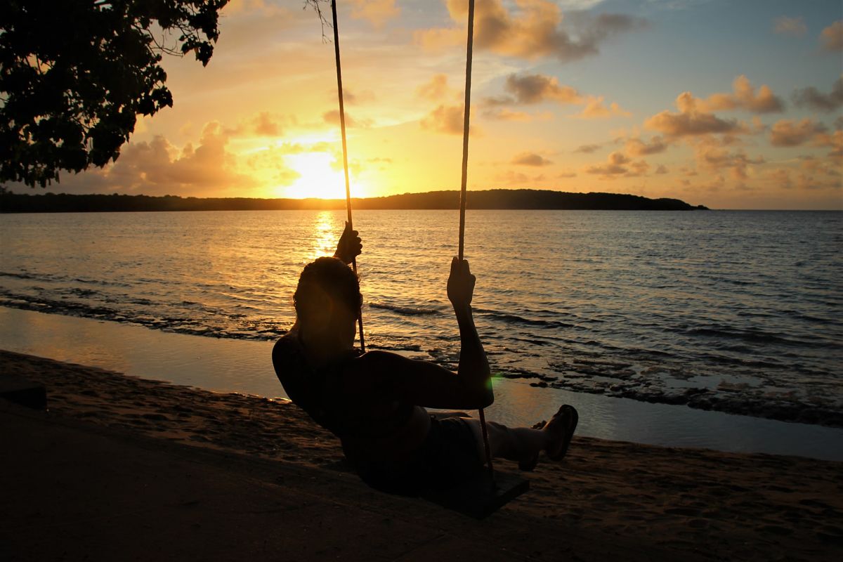 man on swing beahc puertorico