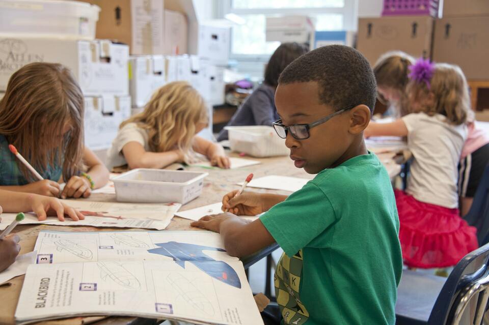 school kid doing classwork