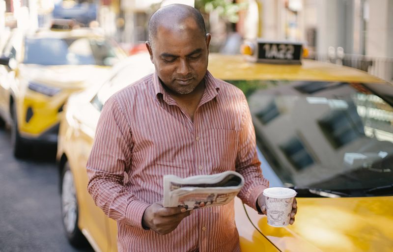 taxi driver uae drinking coffee