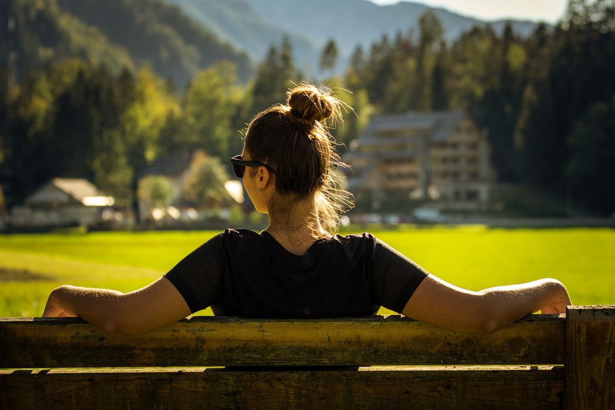 woman relaxing on bench